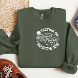 a green sweatshirt with the words, my shittest santa on it