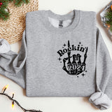 a gray sweatshirt with a rockin'in the 90's design on it