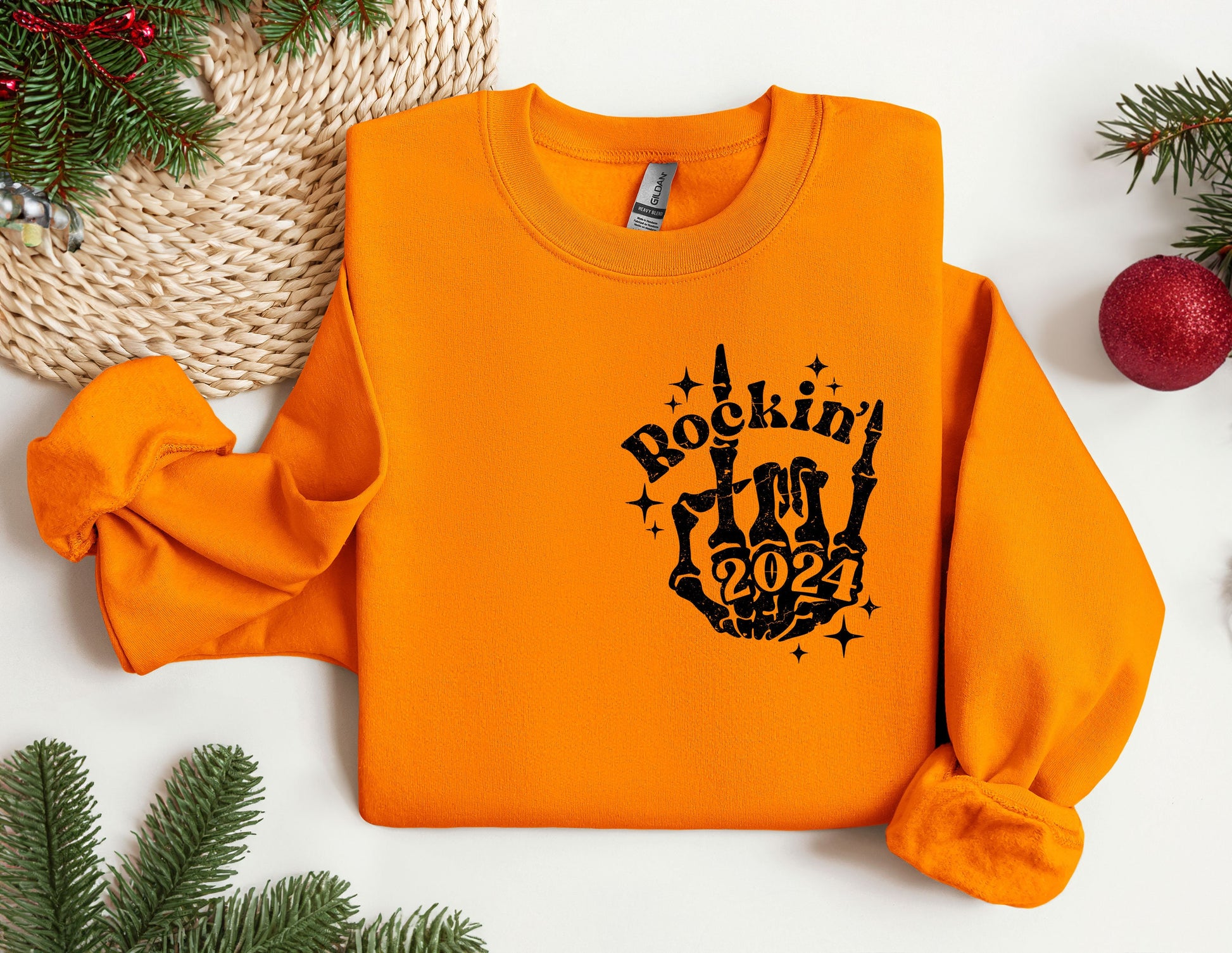 an orange sweatshirt with a rockin&#39;in the 90&#39;s design on it