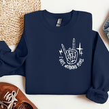 a blue sweatshirt with a white graphic of a hand holding a knife