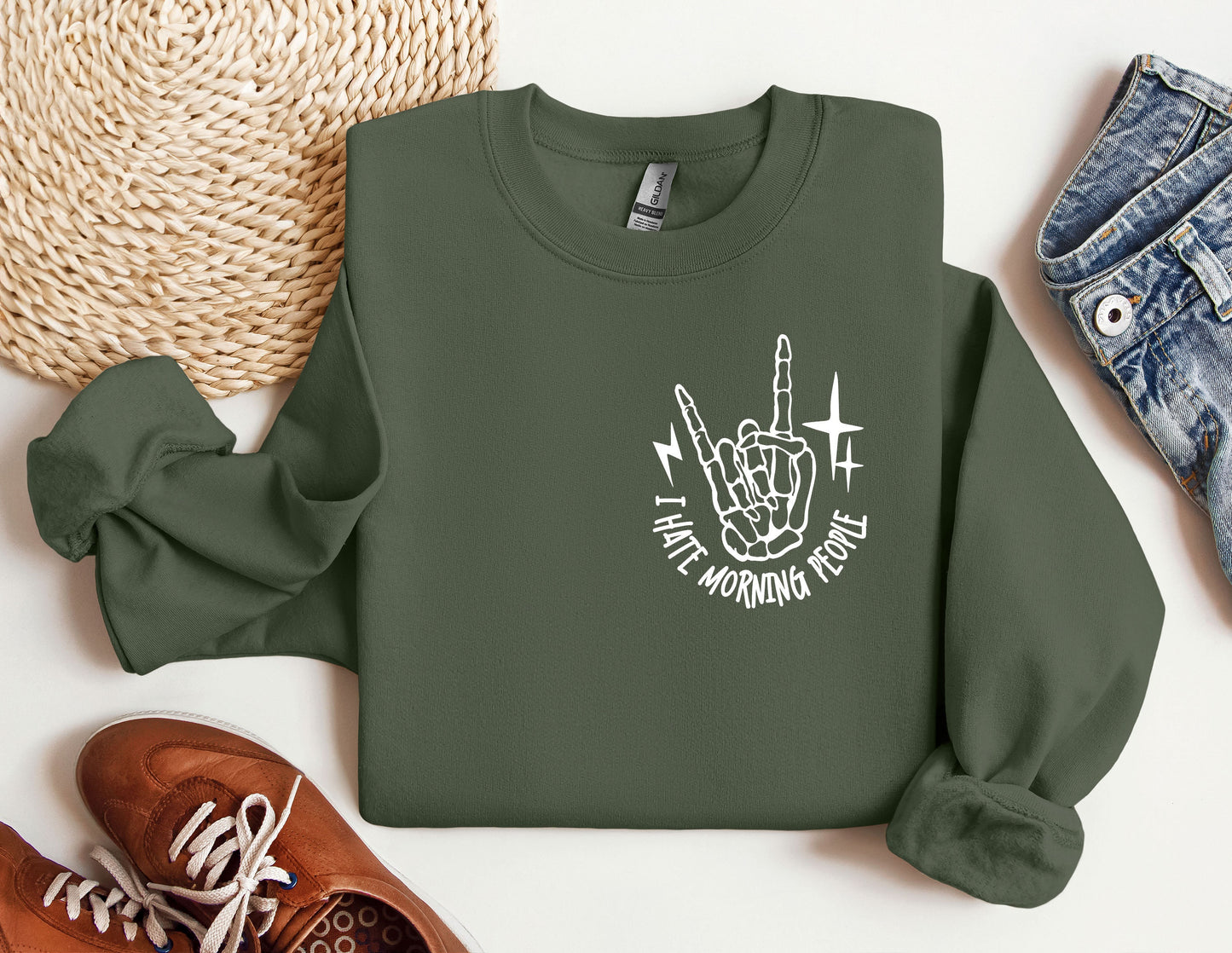 a green sweatshirt with a white graphic on it