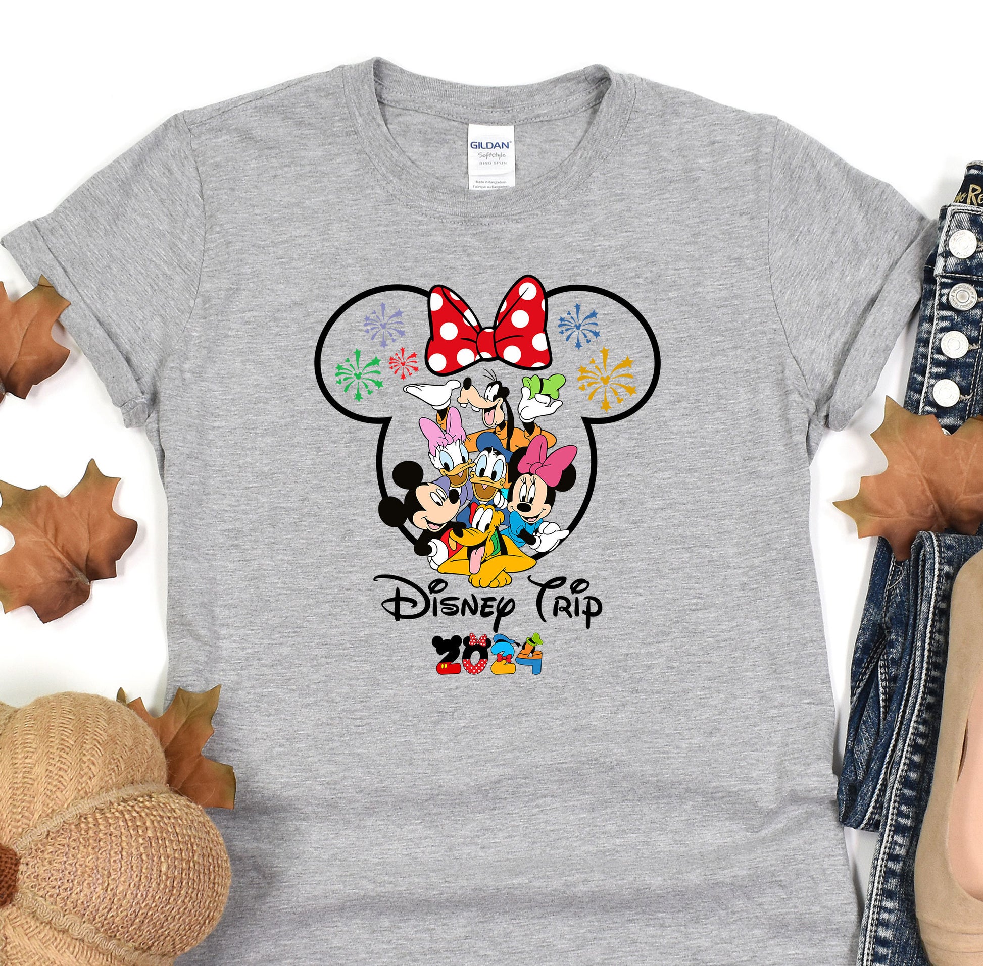 a gray shirt with a mickey mouse and minnie mouse on it