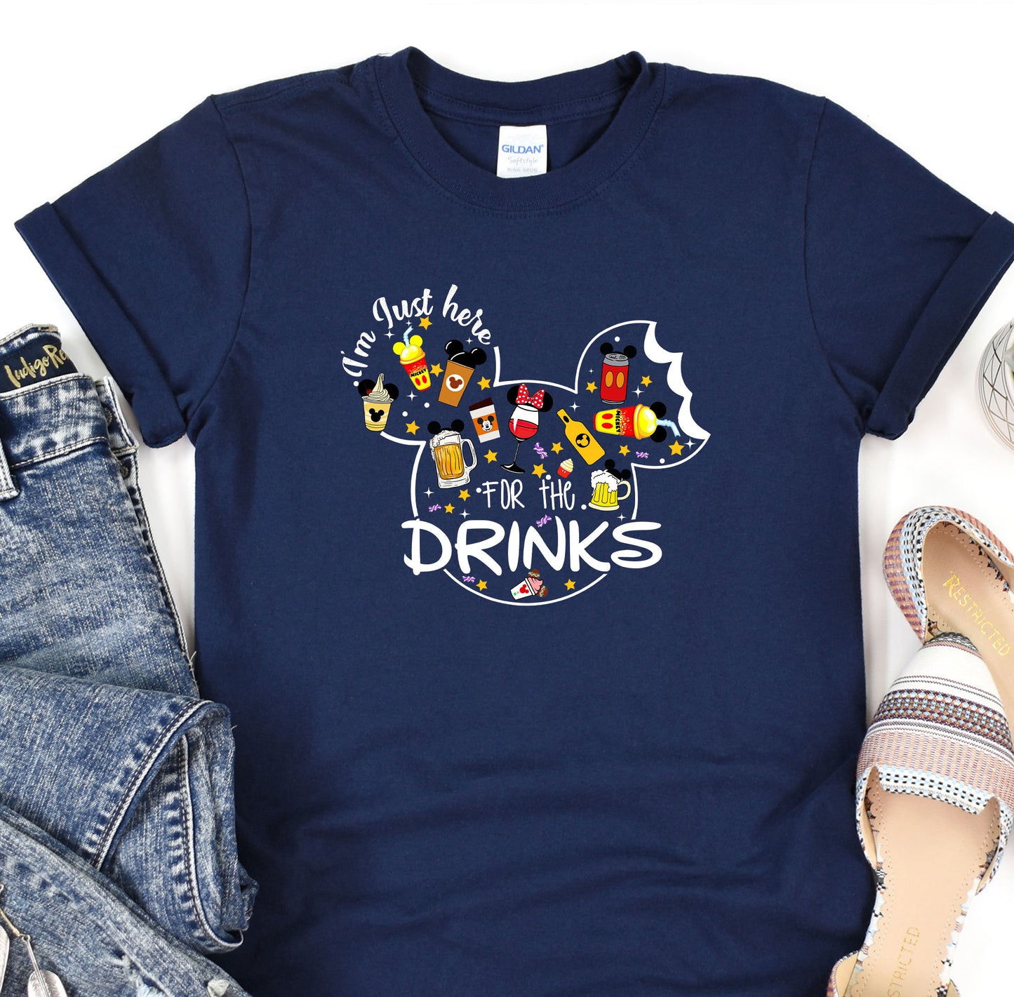 a t - shirt that says just here for the drinks