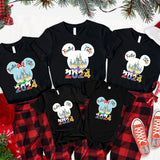 a couple of mickey mouse shirts and pants