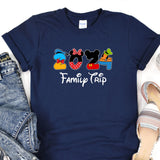 a mickey mouse family trip t - shirt next to a pair of jeans