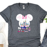 a mickey mouse shirt with a castle in the background