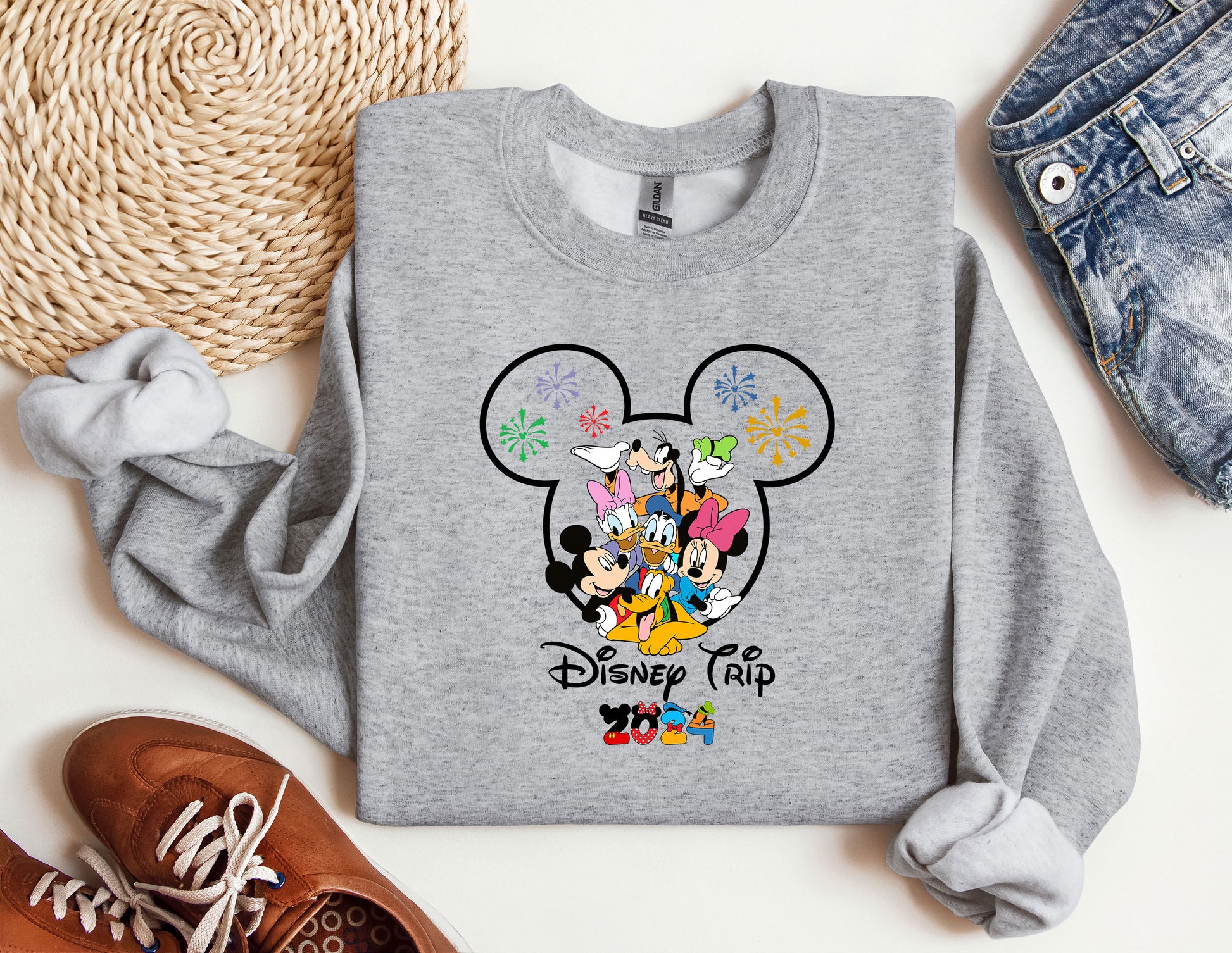 a gray sweatshirt with mickey mouse and friends on it