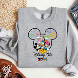 a gray sweatshirt with mickey mouse and friends on it