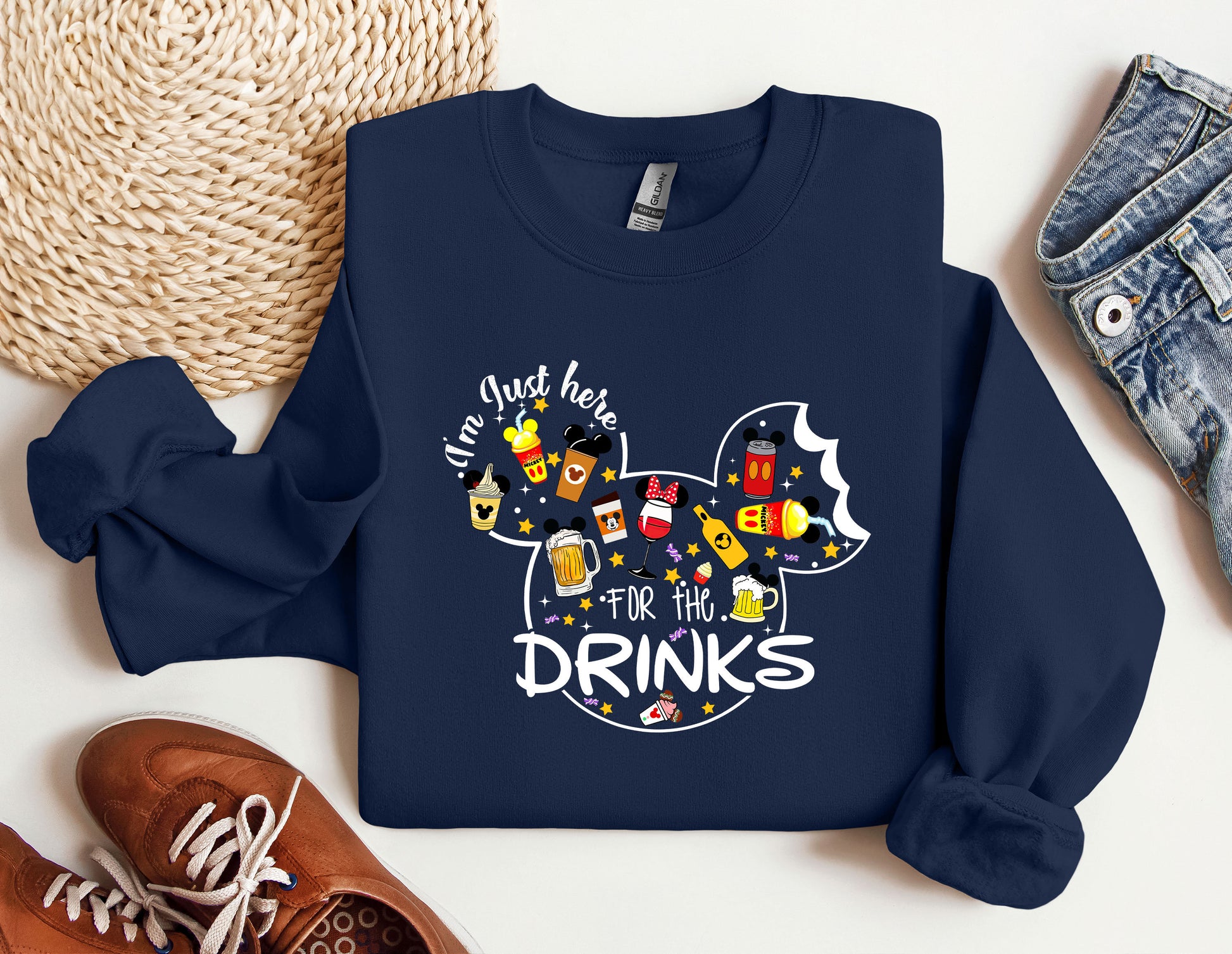 a mickey mouse shirt that says drink here for the drinks