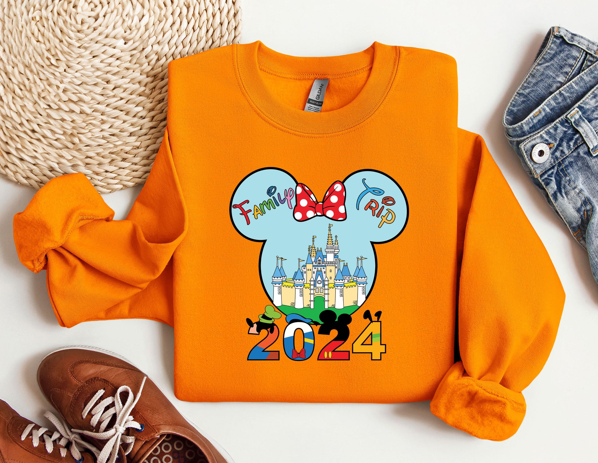 an orange shirt with a mickey mouse on it