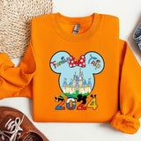 an orange shirt with a mickey mouse on it