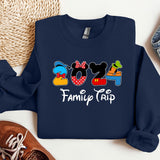 a mickey mouse family trip shirt next to a pair of sneakers