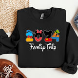 a mickey mouse family trip shirt next to a pair of sneakers