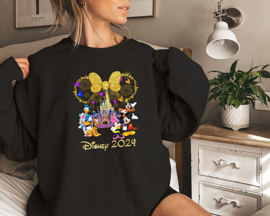 a woman holding onto a mickey mouse shirt