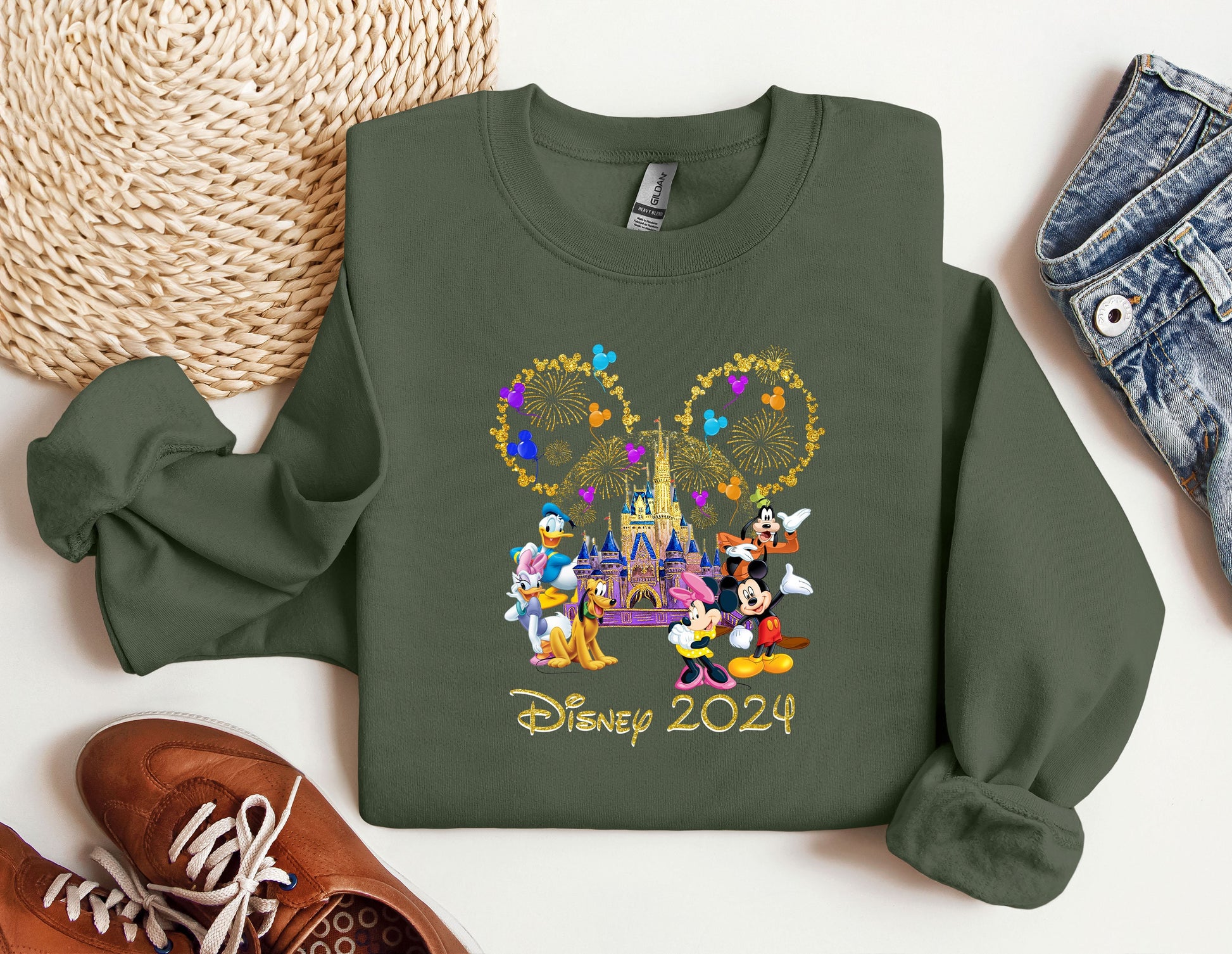 a green sweatshirt with mickey mouse and friends on it