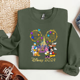 a green sweatshirt with mickey mouse and friends on it