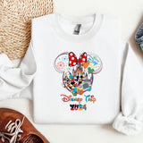 a white shirt with mickey mouse on it