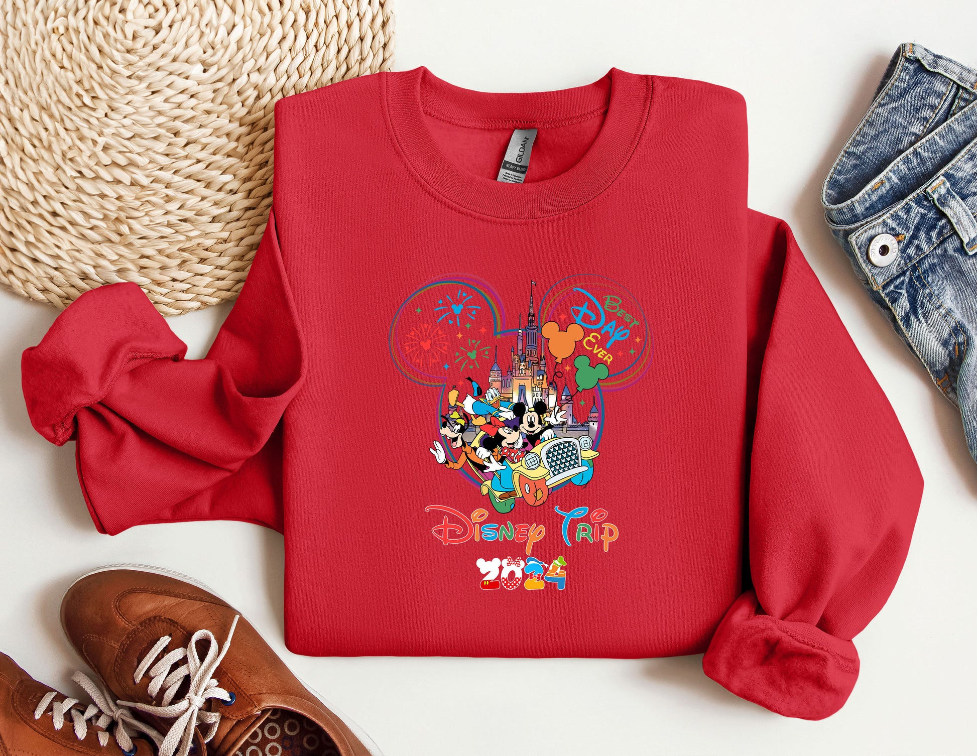 a red sweatshirt with mickey mouse on it