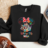 a mickey mouse shirt and some shoes on a table