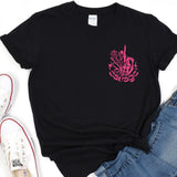 a black shirt with pink graffiti on it