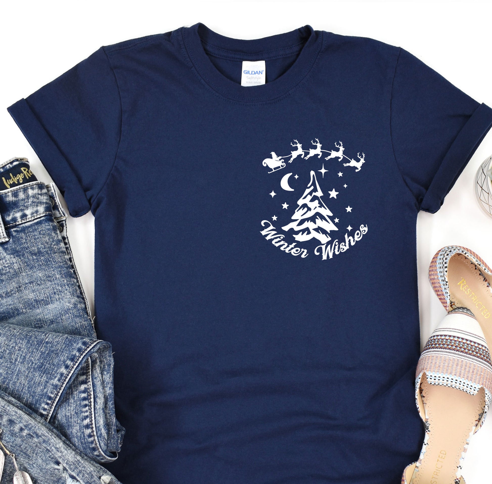 a blue t - shirt with a christmas tree and santa&#39;s sleigh