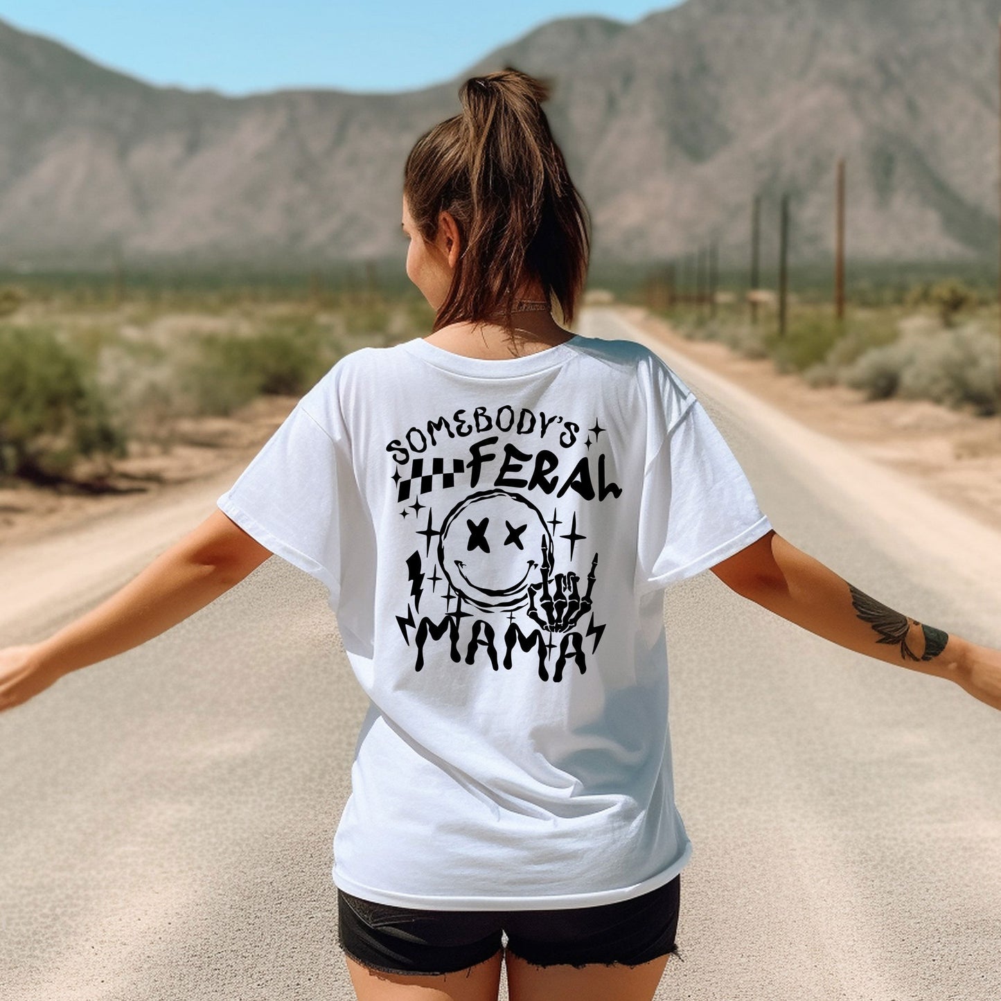 a woman walking down a road with her arms outstretched