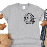 a gray t - shirt with a black and white logo