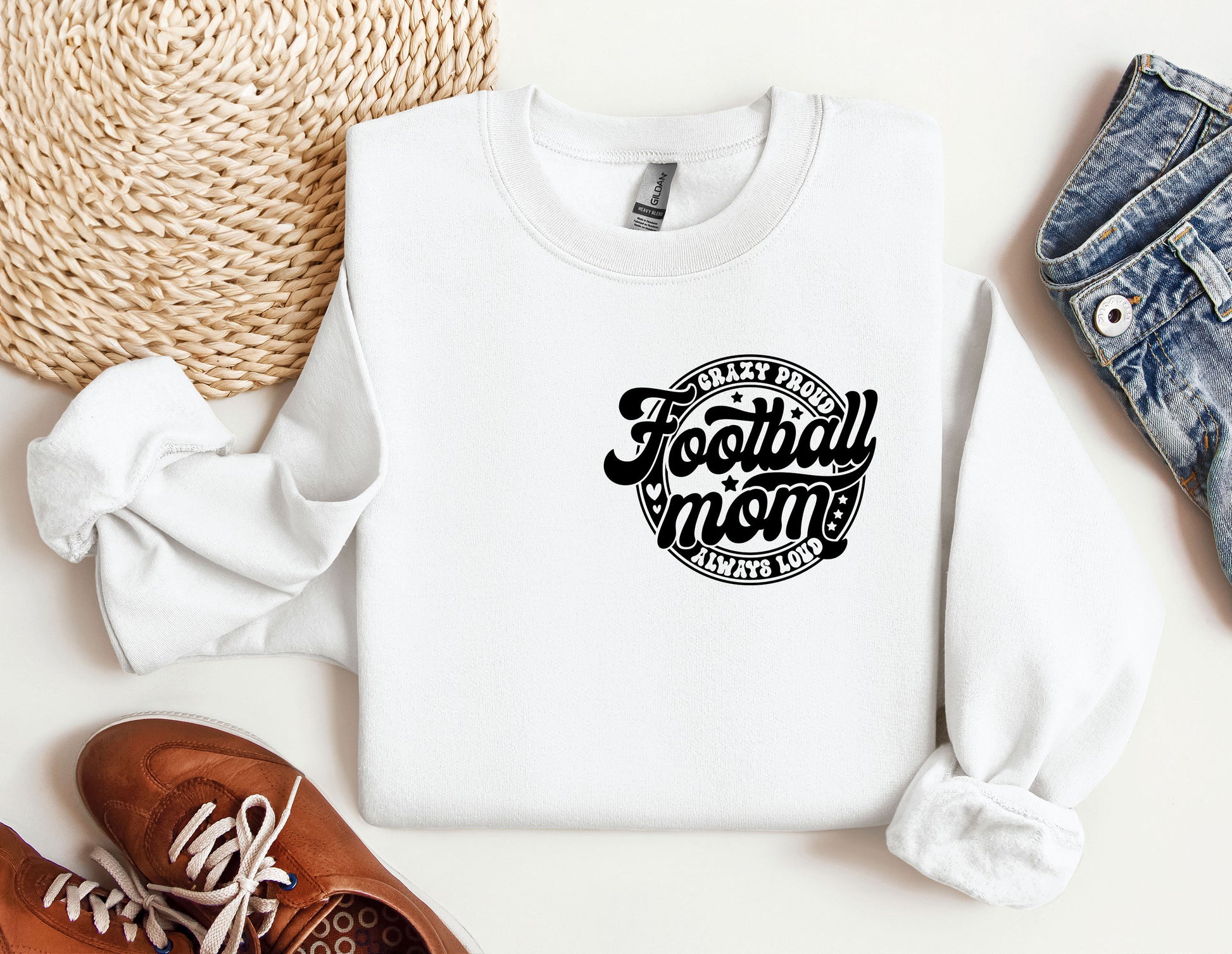 a white sweatshirt with the words football mom on it