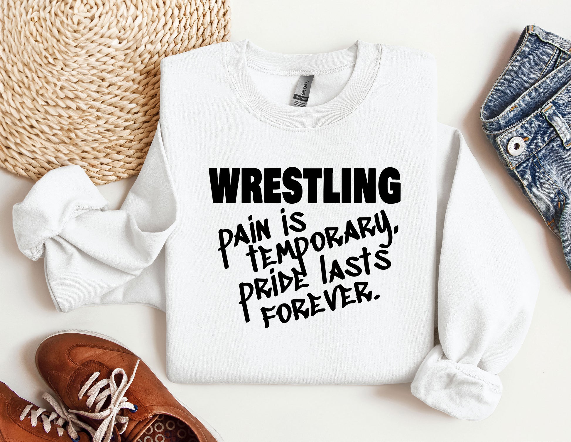 a white shirt that says wrestling pain is temporary