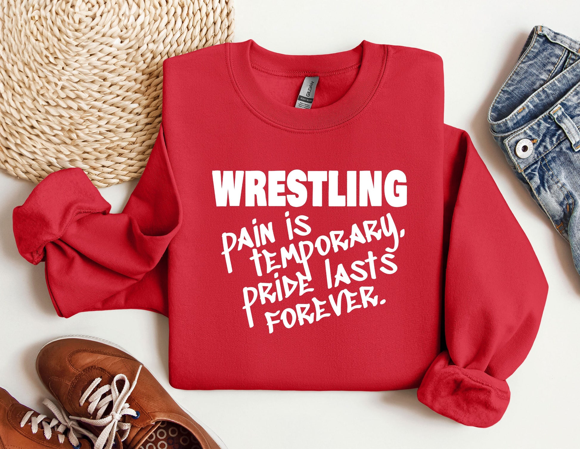 a red sweatshirt with the words wrestling on it