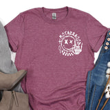 a women's t - shirt with the words motherhood printed on it