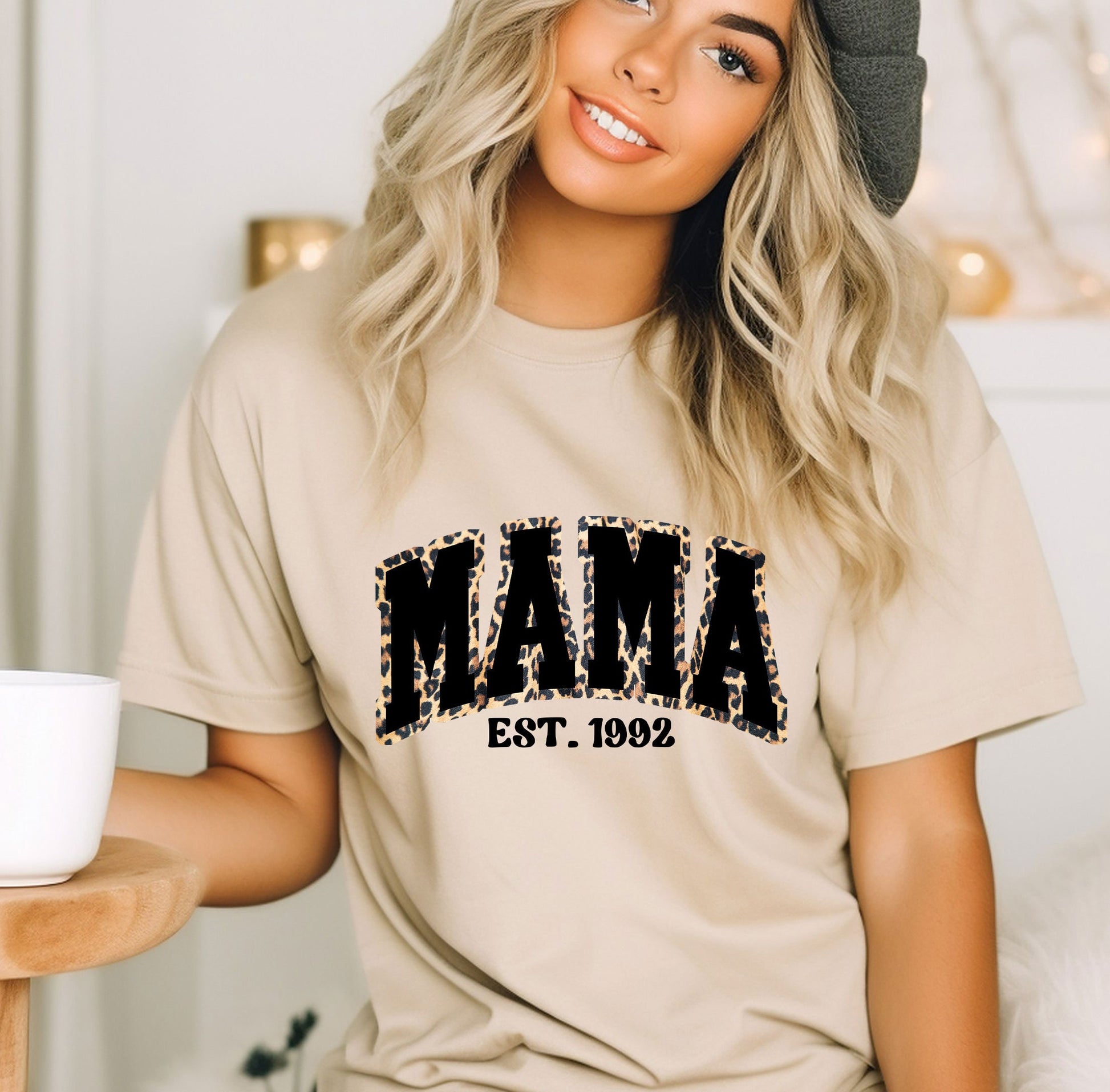 a woman wearing a t - shirt that says mama est 1932