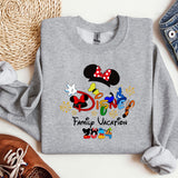 a mickey mouse family vacation shirt next to a pair of shoes