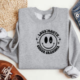 a gray sweatshirt with a smiley face on it