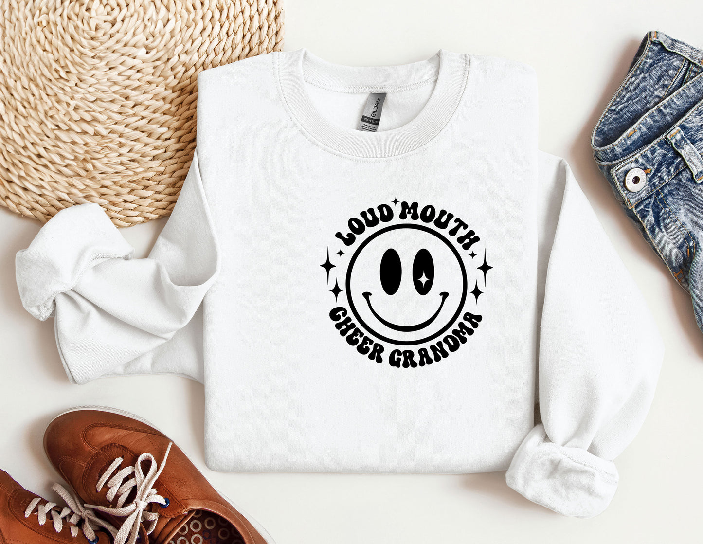 a white sweatshirt with a smiley face on it