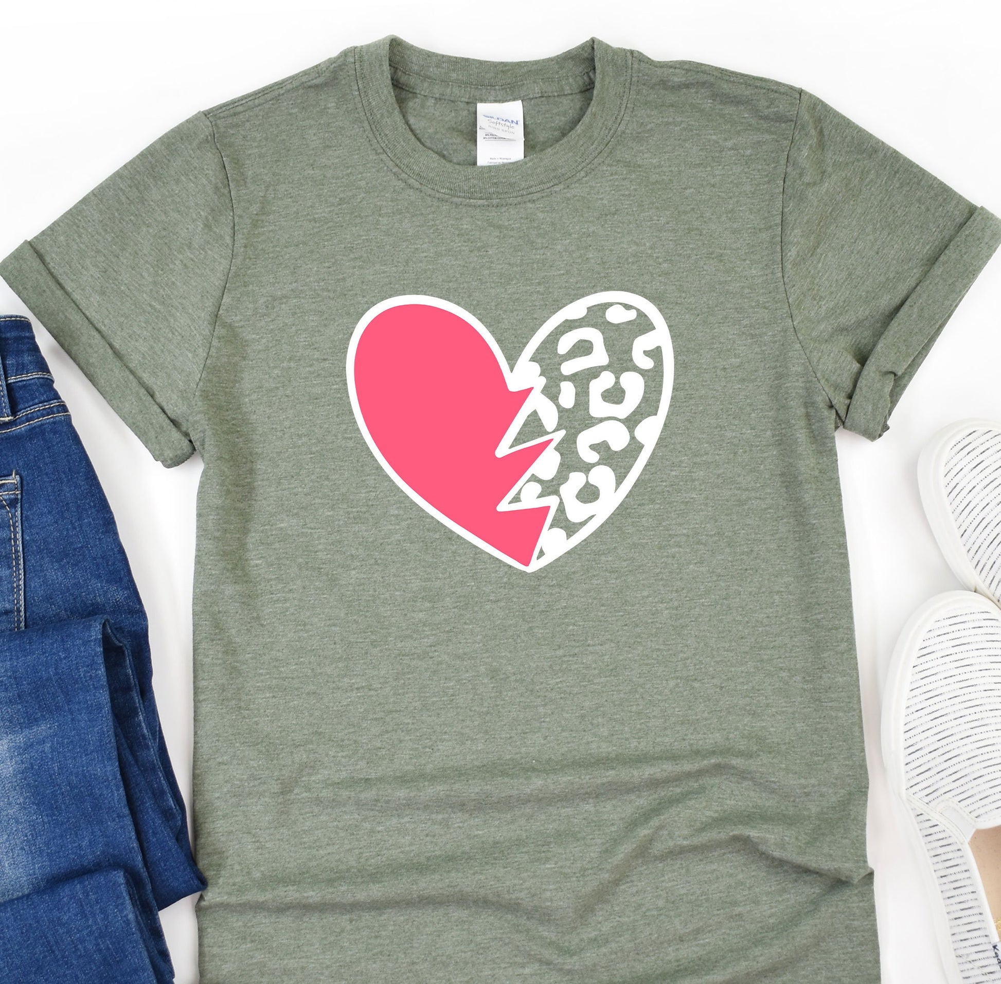 a t - shirt with a heart and lightning bolt on it