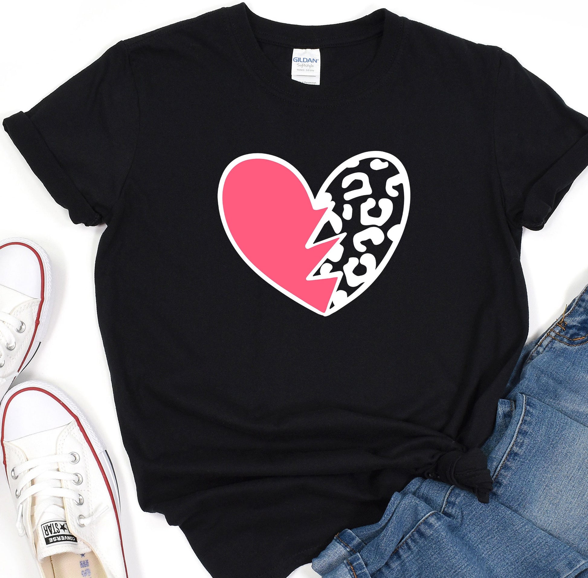 a black t - shirt with a pink heart and a leopard print