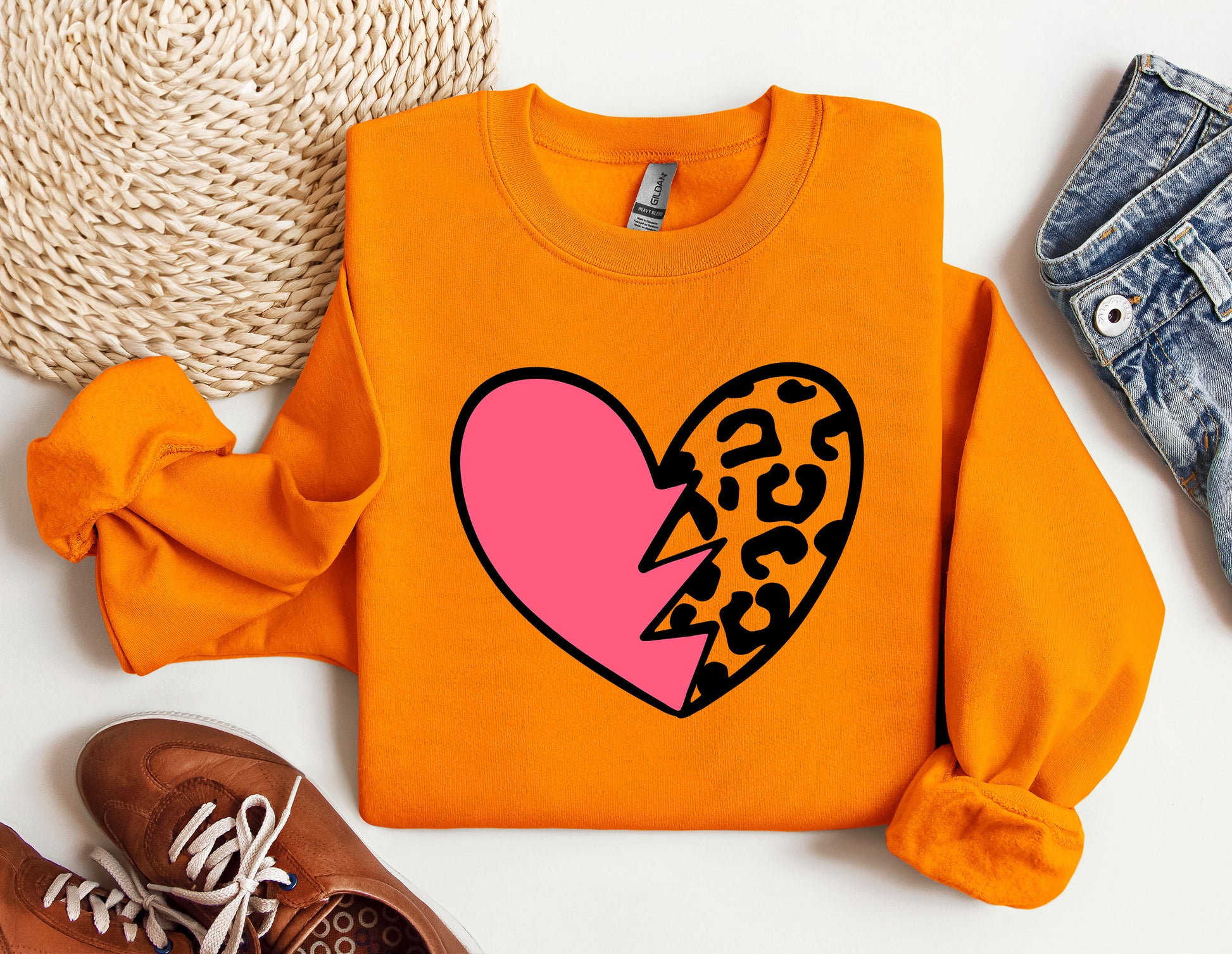 a sweater with a heart and a leopard print on it