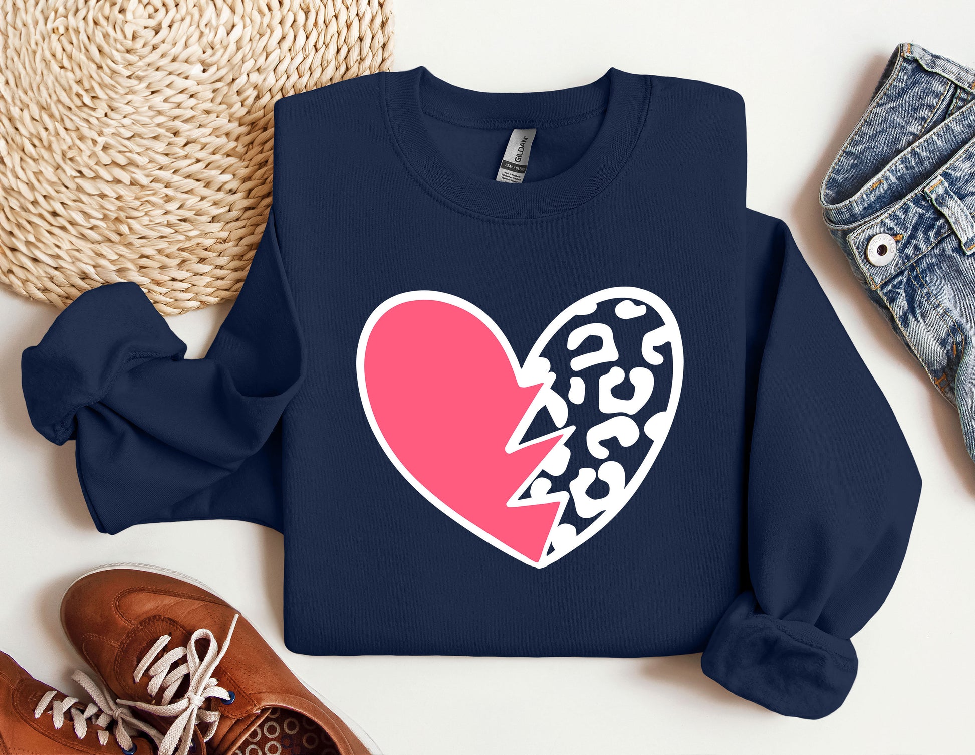 a sweatshirt with a heart and a broken heart on it