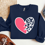 a sweatshirt with a heart and a broken heart on it