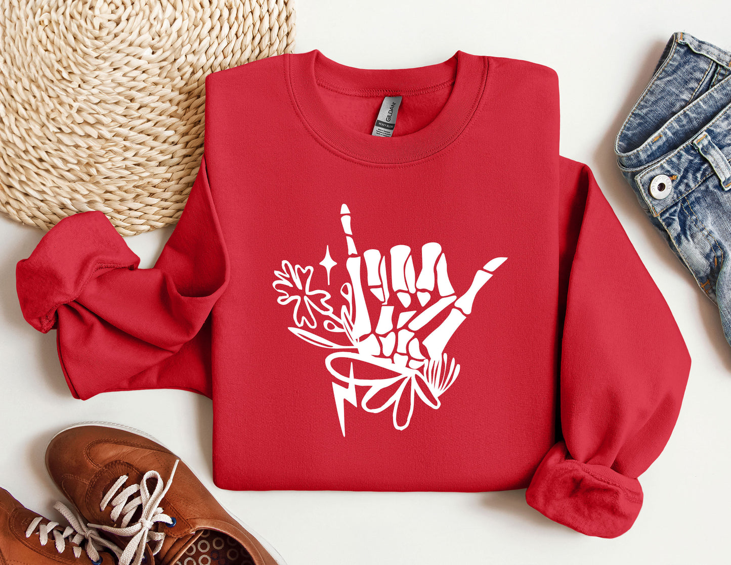 a red sweatshirt with white graffiti on it