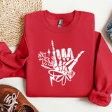 a red sweatshirt with white graffiti on it