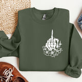 a green sweatshirt with a picture of a building and flowers on it