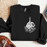 a black sweatshirt with a picture of a building and flowers on it