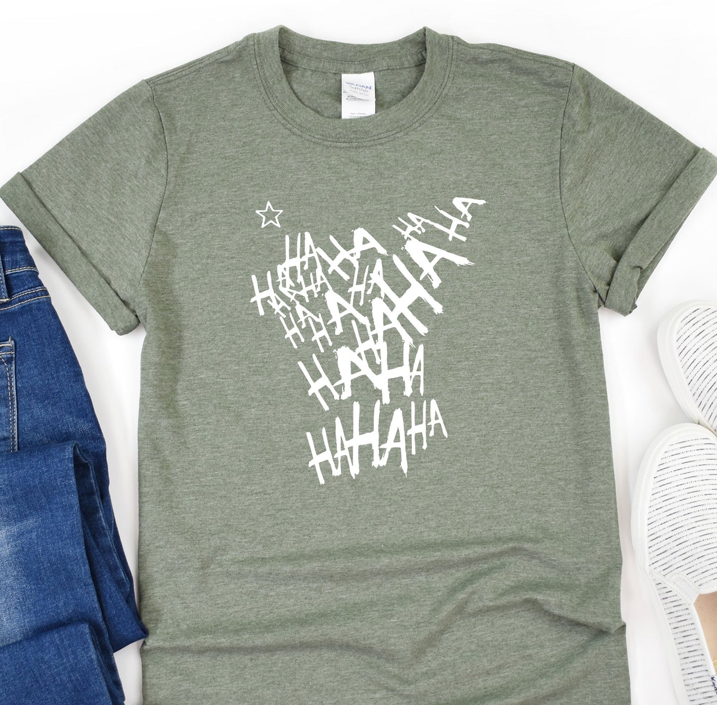 a t - shirt with the words ahaah on it next to a pair