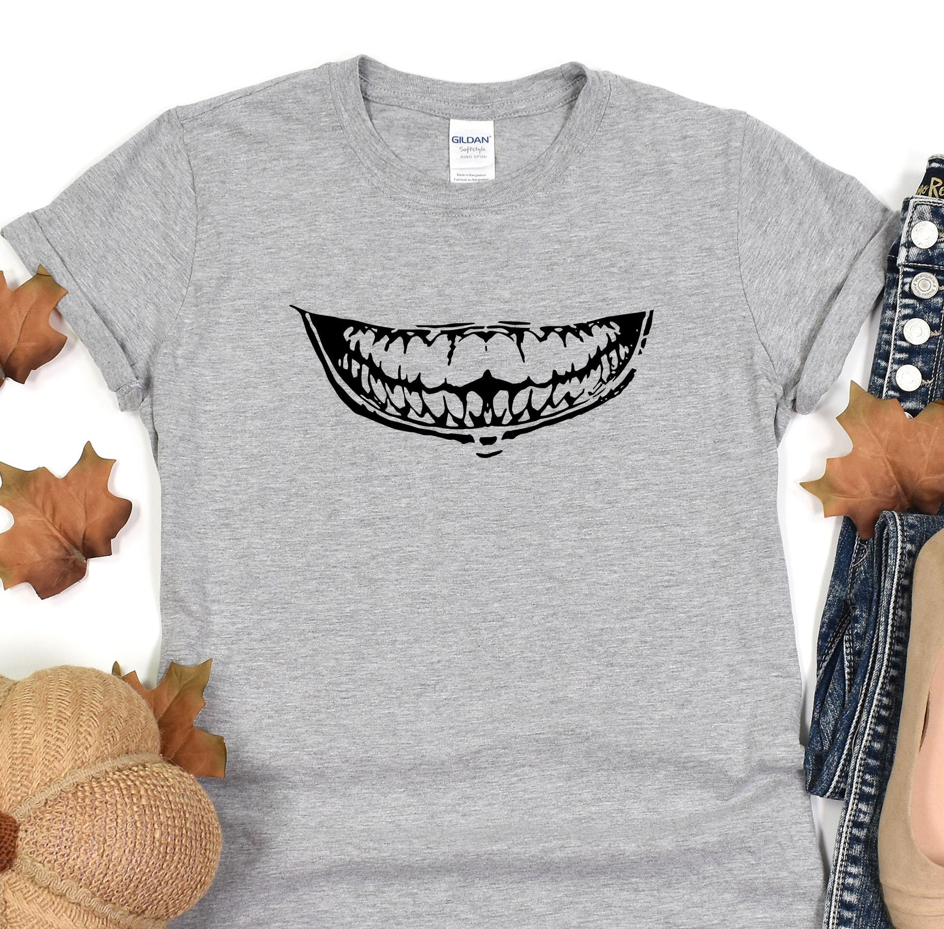 a t - shirt with a mouth full of teeth