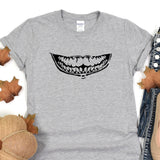 a t - shirt with a mouth full of teeth