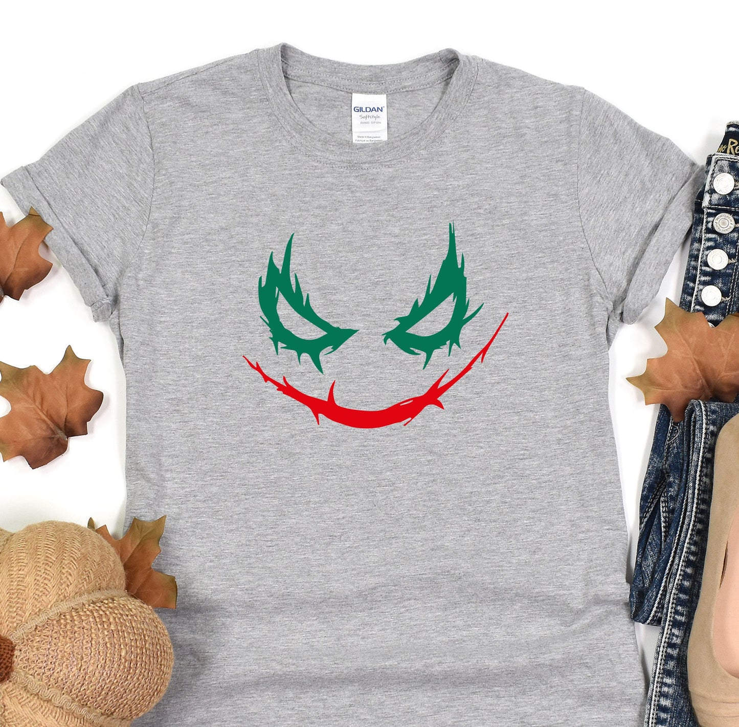 a t - shirt with a joker face painted on it