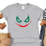 a t - shirt with a joker face painted on it