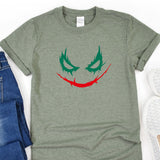 a t - shirt with a joker face painted on it